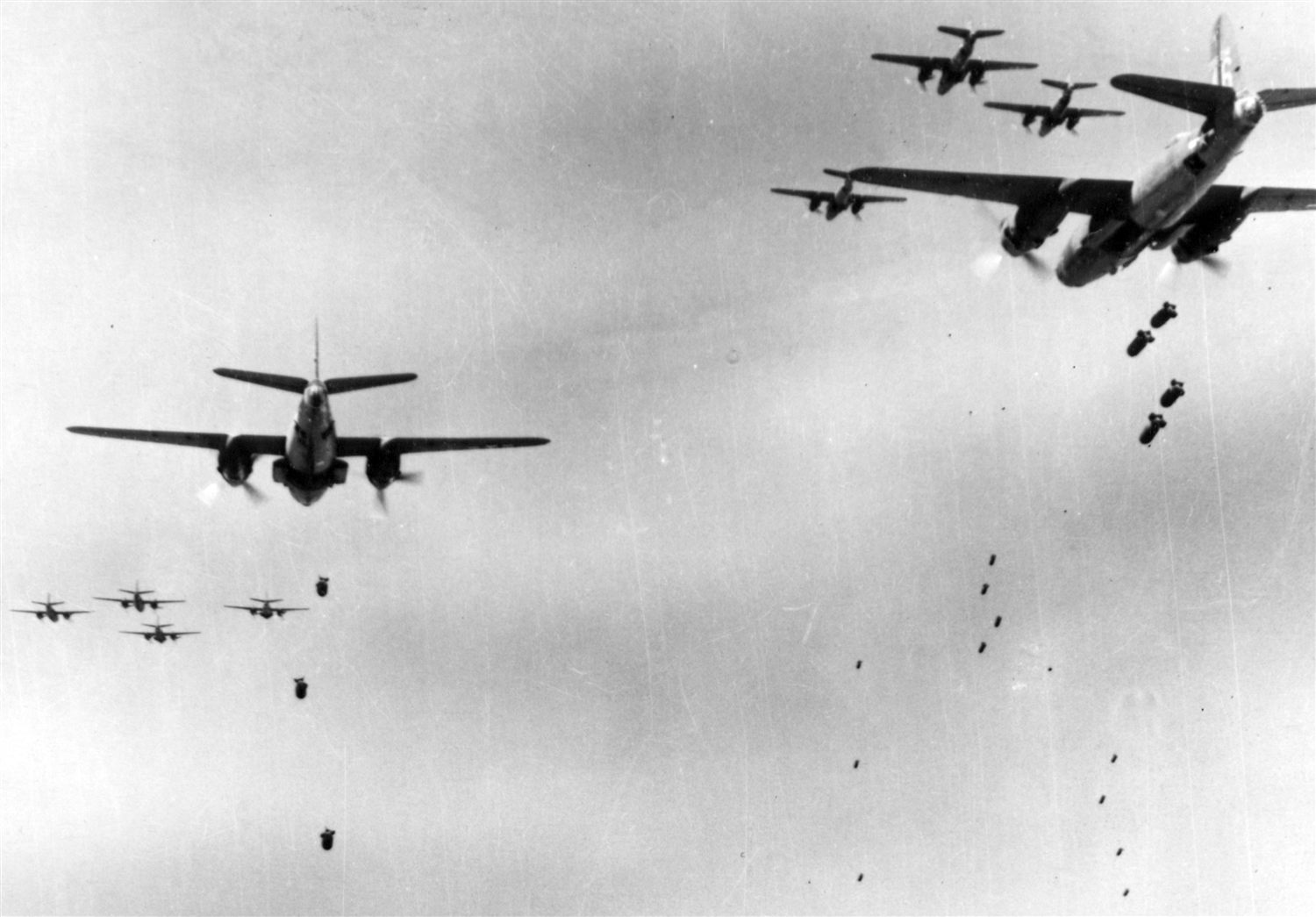 320th Bomb Group B-26 Marauders releasing bombs over Albenga, Italy, on 12 April 1944